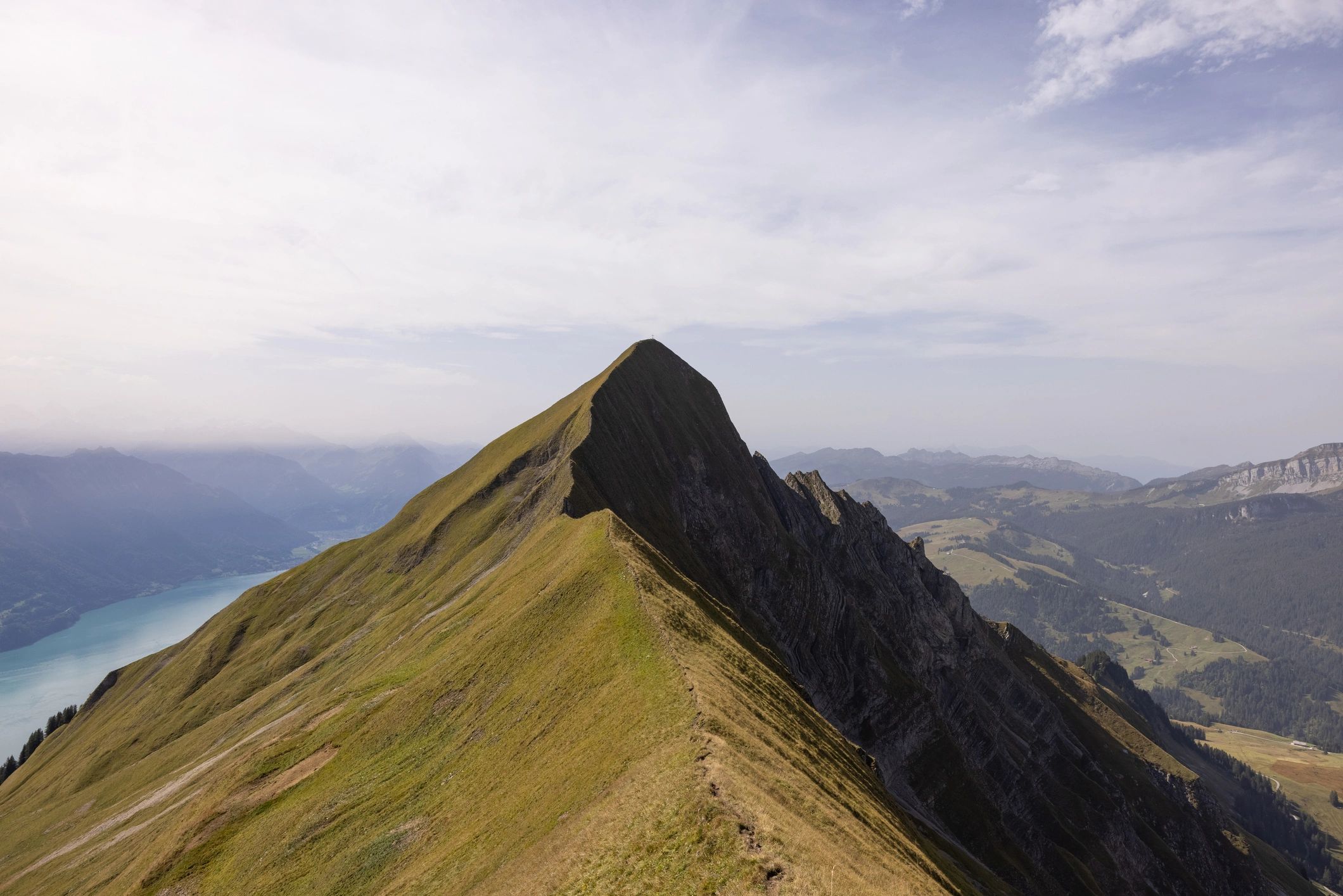 Swiss Alps ridge above a lake representing senior perspective