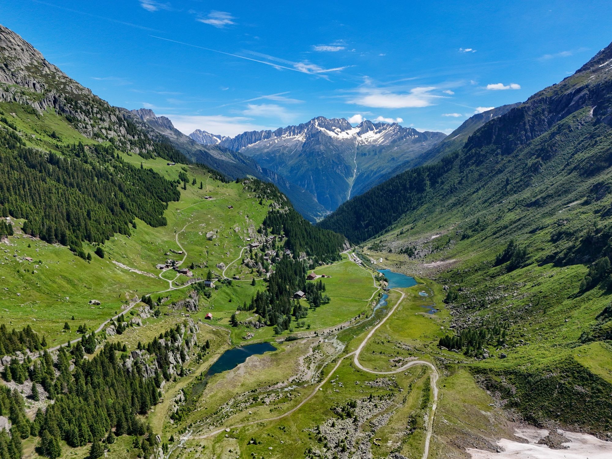 Alpine valley and mountain range representing stable foundations and oversight